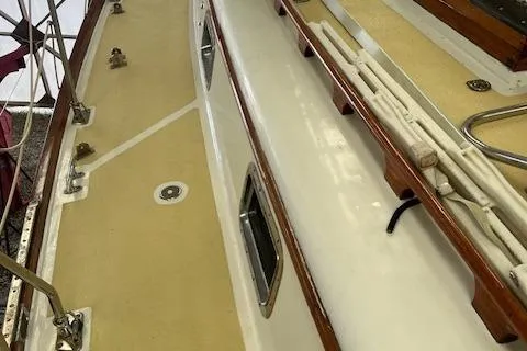 Slide: The Image of Deck view of 1984 Mason 43 Cutter sailboat with wooden trim and fittings. - 47
