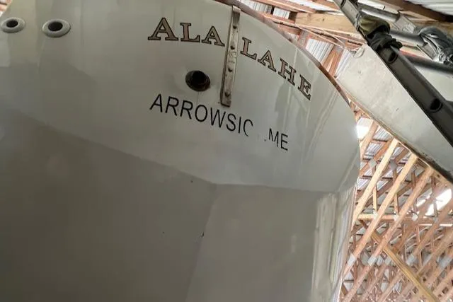Slide: The Image of Sailboat stern with "ALA LAHE" and "ARROWSIC ME" text, Mason 43 Cutter, 1984 model. - 48