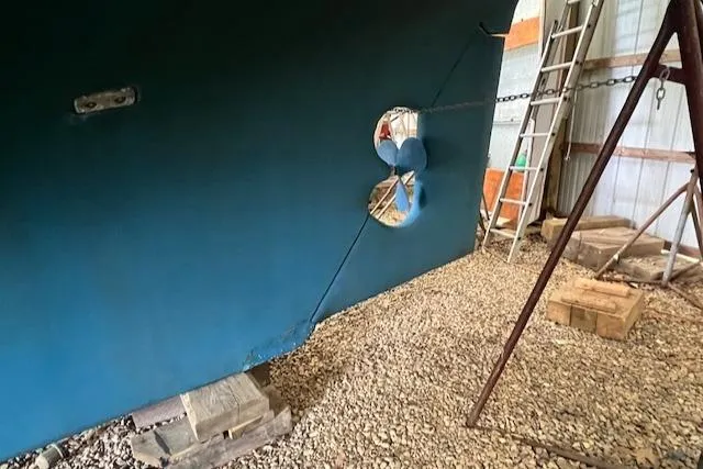 Slide: The Image of Mason 43 Cutter 1984 sailboat hull with propeller in dry dock. - 49