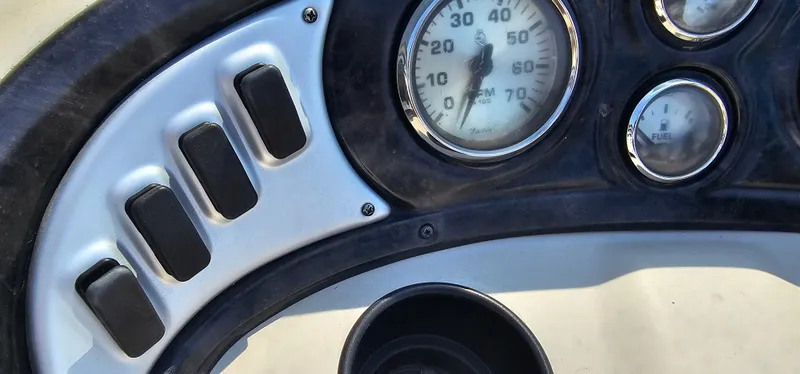 Slide: The Image of Dashboard of 2017 G3 Sun Catcher V322C boat with gauges and switches. - 11
