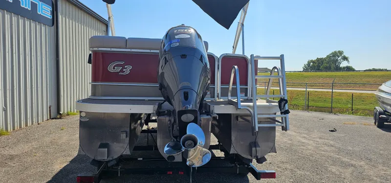 Slide: The Image of 2017 G3 Sun Catcher V322C pontoon boat with outboard motor, parked outdoors. - 3