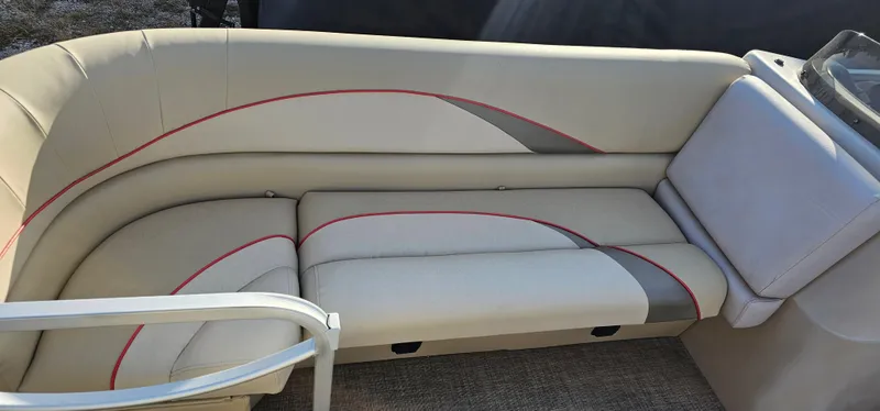 Slide: The Image of 2017 G3 Sun Catcher V322C boat seating with beige upholstery and red accents. - 5