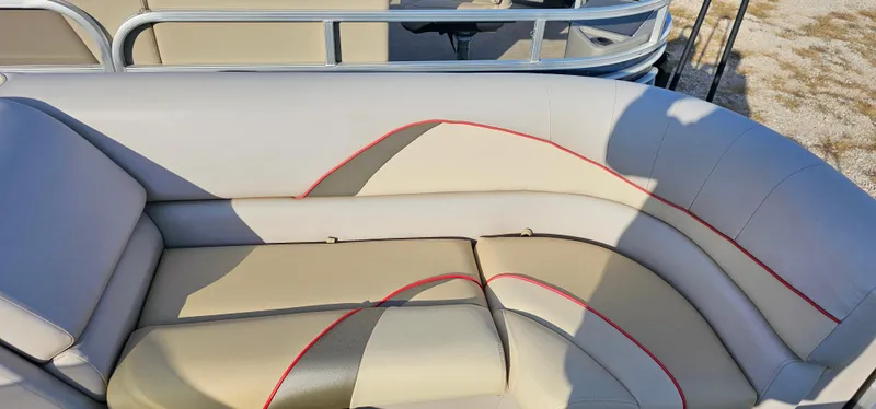 Slide: The Image of 2017 G3 Sun Catcher V322C boat seating with beige upholstery and red accents. - 6