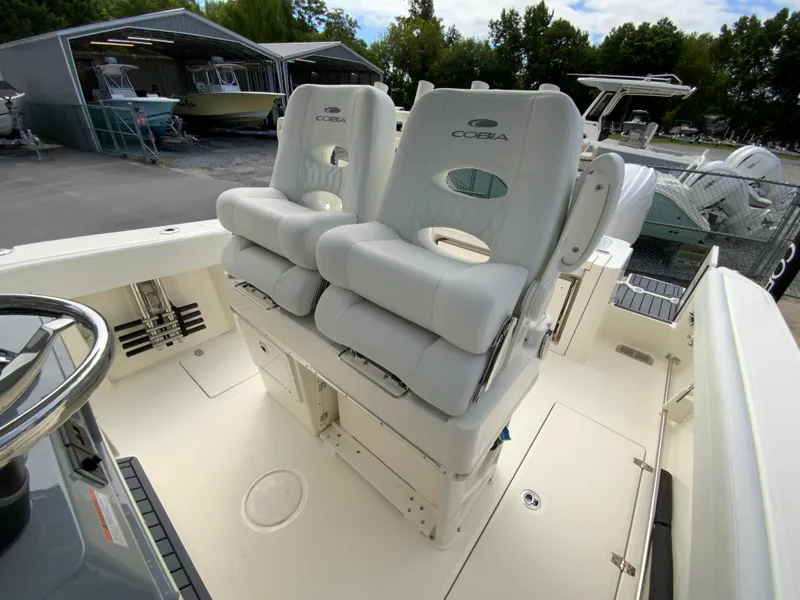 Slide: The Image of 2025 Cobia 265 Center Console Open boat with dual cushioned seats. - 12