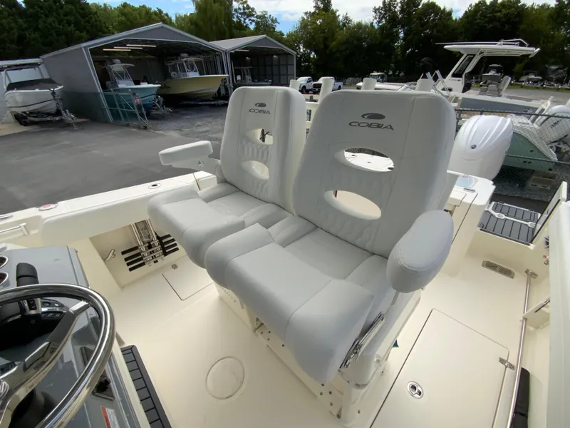 Slide: The Image of 2025 Cobia 265 Center Console Open boat with dual cushioned seats. - 13