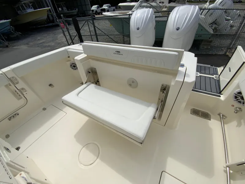 Slide: The Image of 2025 Cobia 265 Center Console Open boat interior with foldable seating. - 15