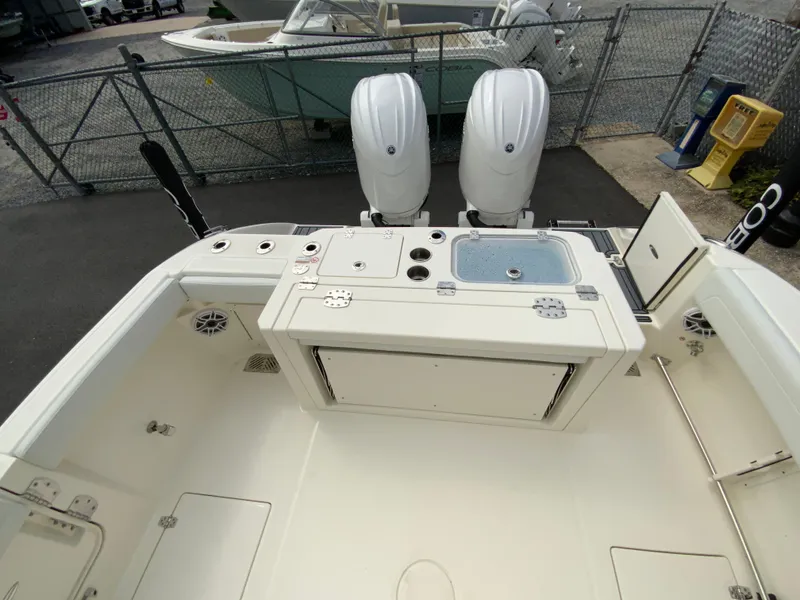 Slide: The Image of 2025 Cobia 265 Center Console Open boat with dual engines and spacious deck. - 16