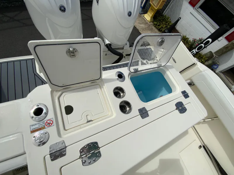Slide: The Image of 2025 Cobia 265 Center Console Open boat with open storage compartments and fishing features. - 17