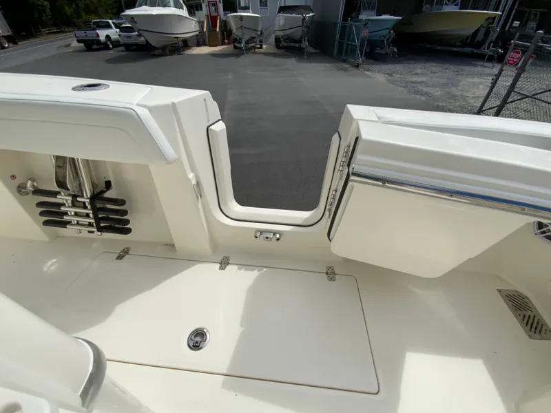 Slide: The Image of 2025 Cobia 265 Center Console Open boat interior with open transom door. - 22