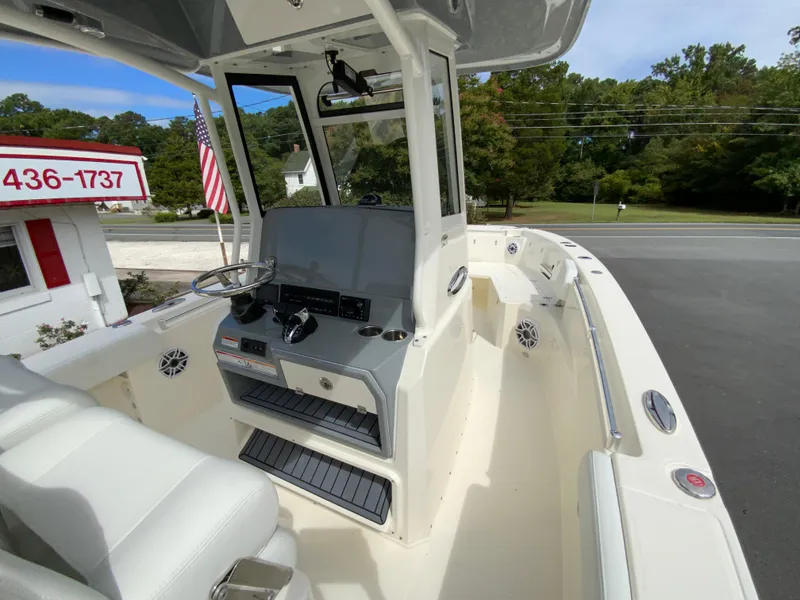 Slide: The Image of 2025 Cobia 265 Center Console Open boat, featuring sleek design and modern controls. - 23