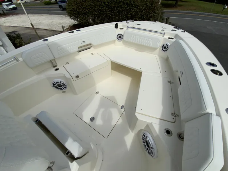 Slide: The Image of 2025 Cobia 265 Center Console Open boat interior with seating and storage compartments. - 24