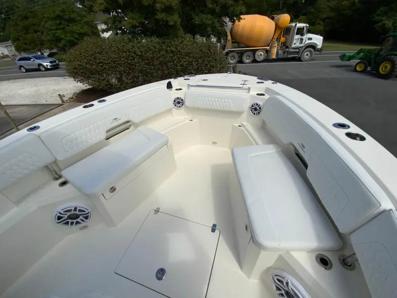 Slide: The Image of 2025 Cobia 265 Center Console Open boat interior with seating and speakers. - 29