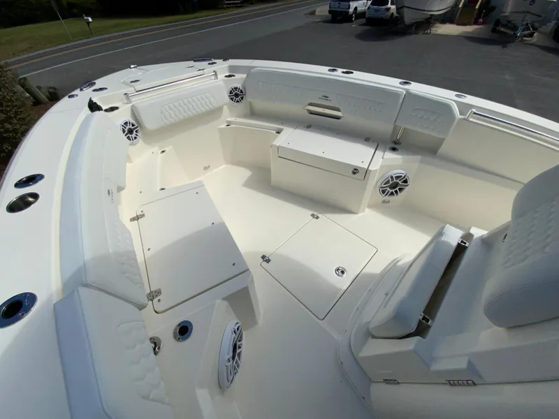 Slide: The Image of 2025 Cobia 265 Center Console Open boat interior with seating and storage. - 30
