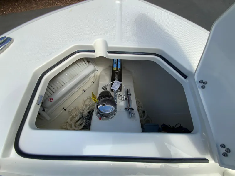 Slide: The Image of 2025 Cobia 265 Center Console Open anchor storage compartment. - 32