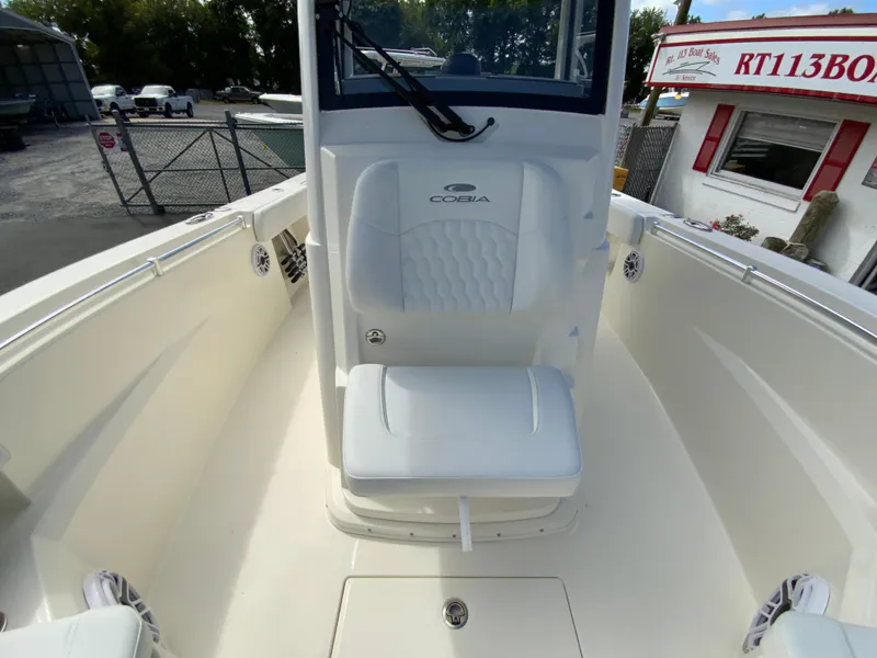 Slide: The Image of 2025 Cobia 265 Center Console Open boat interior with seating and console view. - 35