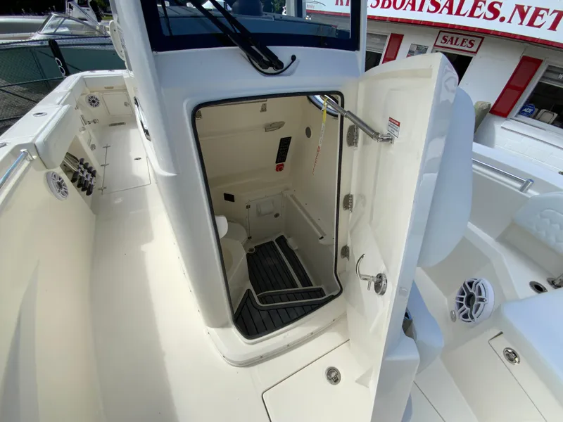 Slide: The Image of 2025 Cobia 265 Center Console Open boat interior with open storage compartment. - 36
