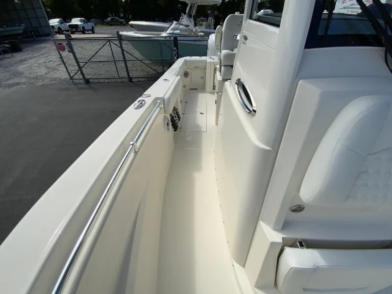 Slide: The Image of 2025 Cobia 265 Center Console Open boat interior with sleek design and spacious walkway. - 40