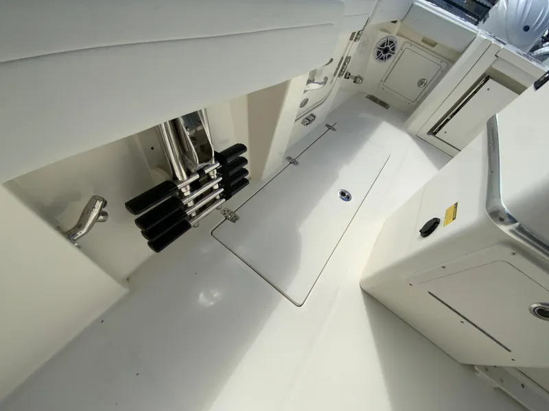 Slide: The Image of 2025 Cobia 265 Center Console Open boat interior, featuring storage compartments and sleek design. - 41