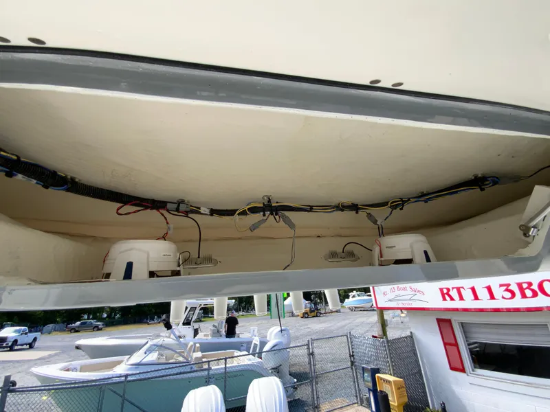 Slide: The Image of 2025 Cobia 265 Center Console Open boat interior wiring and storage view. - 44
