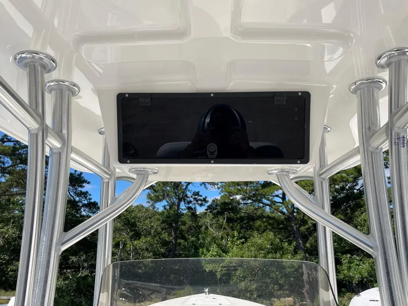 Slide: The Image of 2025 Defiance 240 Catalina boat interior with sturdy metal framework and overhead console. - 6