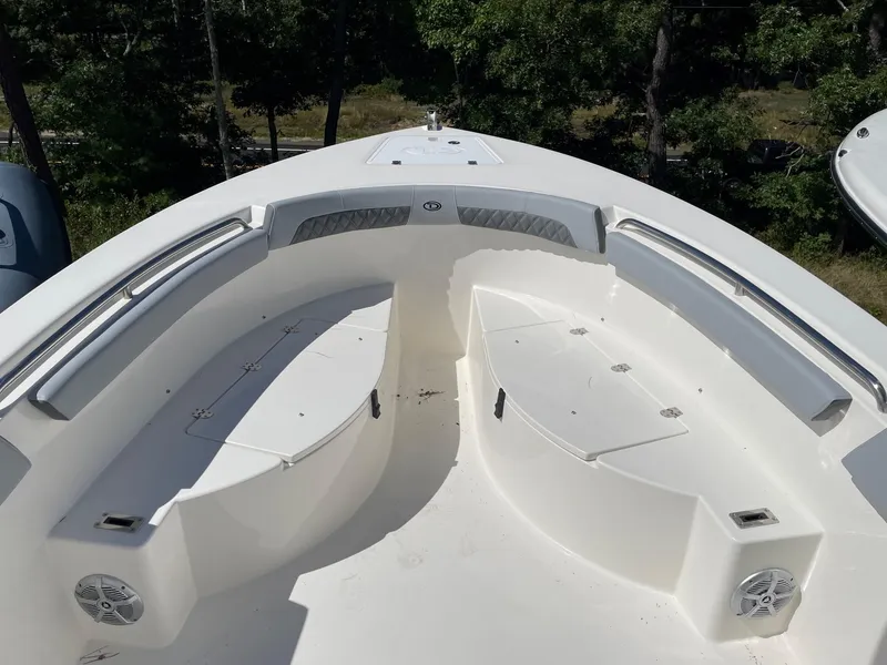 Slide: The Image of 2025 Defiance 240 Catalina boat interior with seating and storage compartments. - 8