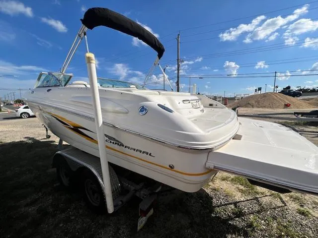 The Image of 2002 Chaparral 220 SSi boat on trailer under blue sky. - 0