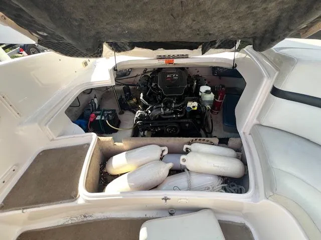 Slide: The Image of 2002 Chaparral 220 SSi boat engine compartment with fenders and equipment. - 15