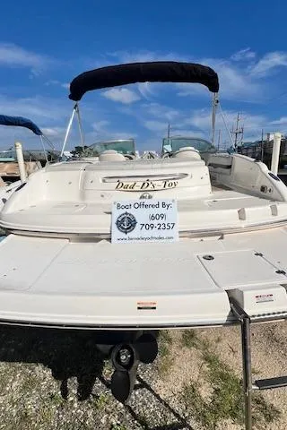Slide: The Image of 2002 Chaparral 220 SSi boat with "Dad D's Toy" sign, for sale contact info visible. - 3