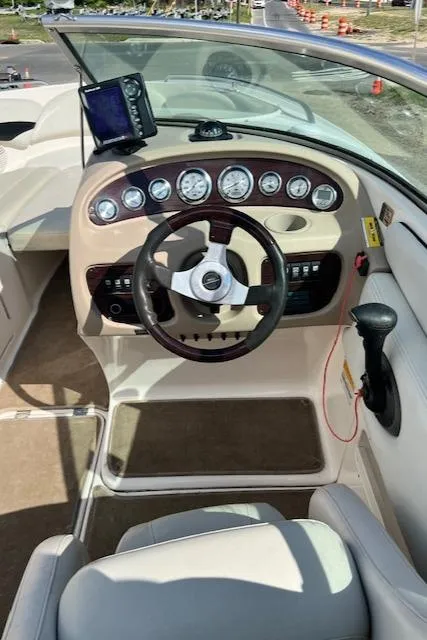 Slide: The Image of 2002 Chaparral 220 SSi boat dashboard with steering wheel and gauges. - 5