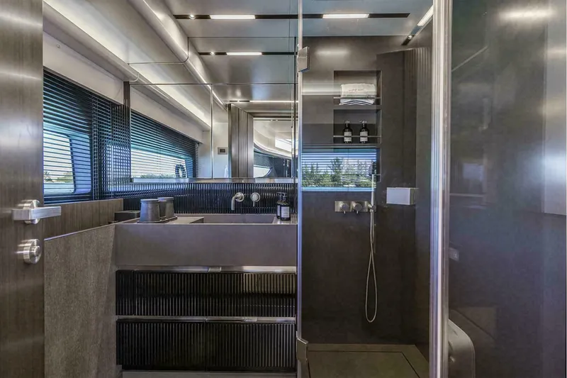 Slide: The Image of Luxurious modern bathroom in 2025 Pearl 72 yacht with sleek design and ample natural light. - 15