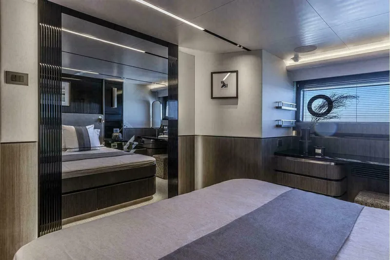 Slide: The Image of Luxurious bedroom interior on 2025 Pearl 72 yacht, featuring modern design and elegant furnishings. - 17