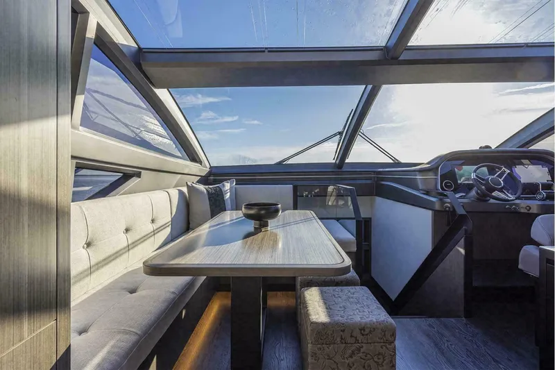 Slide: The Image of Luxurious interior of 2025 Pearl 72 yacht with panoramic windows and elegant seating area. - 20