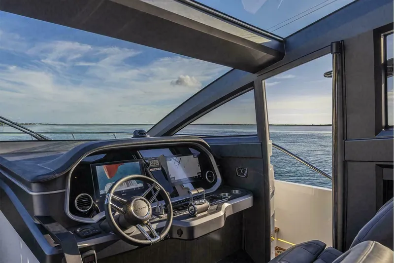 Slide: The Image of Luxurious Pearl 72 yacht cockpit with modern controls, overlooking serene ocean view, 2025 model. - 21
