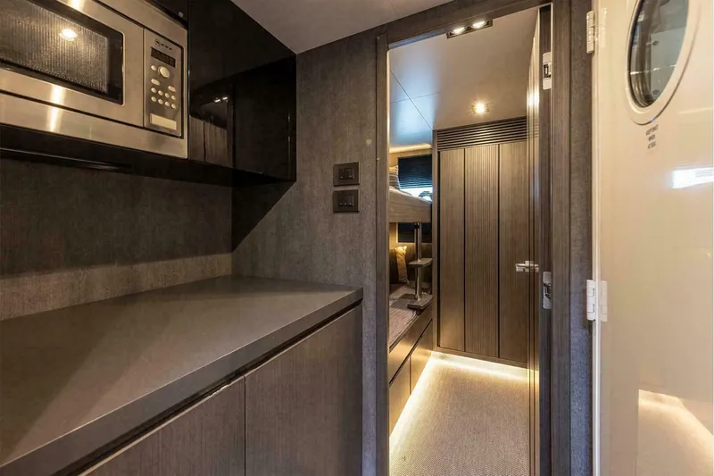 Slide: The Image of Modern yacht interior with kitchenette and cozy cabin, Pearl 72, 2025 model. - 24