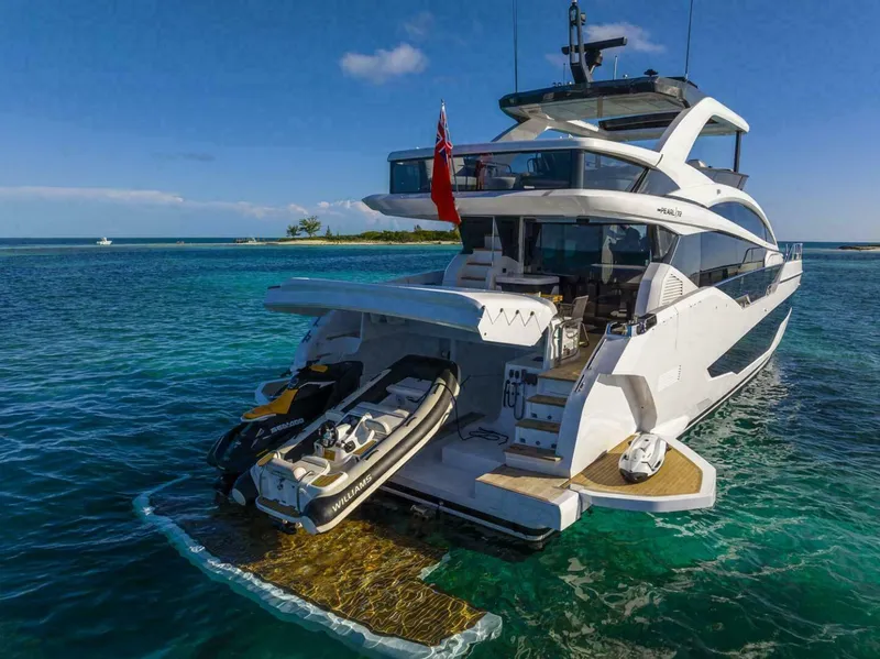 Slide: The Image of Luxury Pearl 72 yacht, 2025 model, anchored in clear blue waters. - 26