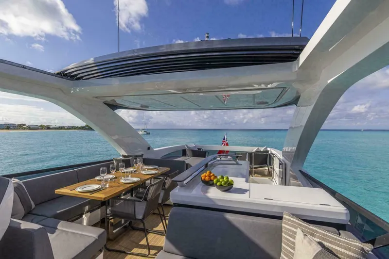 Slide: The Image of Luxurious Pearl 72 yacht deck with dining area, ocean view, and modern design, 2025 model. - 31