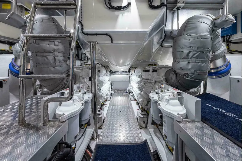 Slide: The Image of Engine room of 2025 Pearl 72 yacht with advanced machinery and metallic flooring. - 35