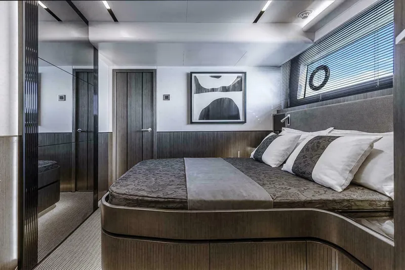 Slide: The Image of Luxurious bedroom interior of 2025 Pearl 72 yacht with modern decor and elegant furnishings. - 7