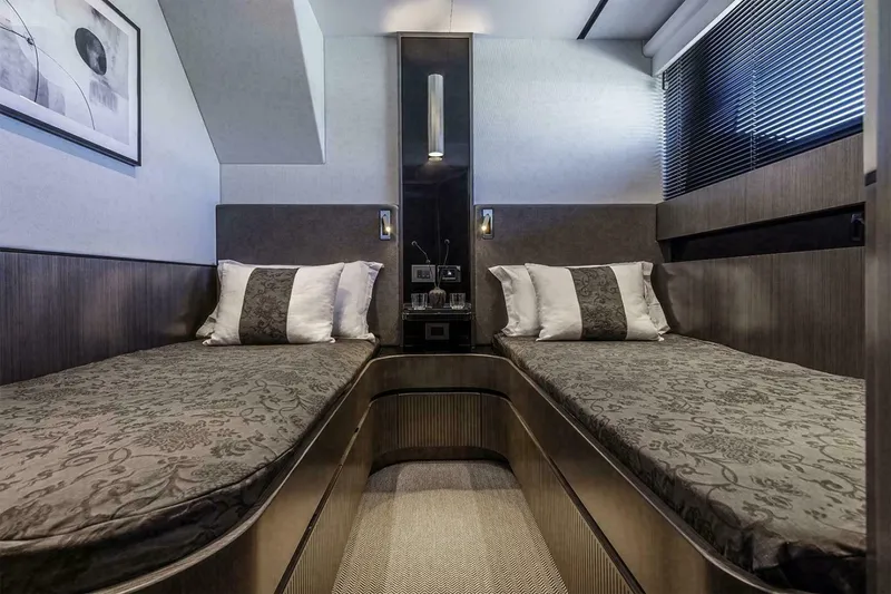 Slide: The Image of Luxurious twin cabin interior of 2025 Pearl 72 yacht with modern decor. - 9
