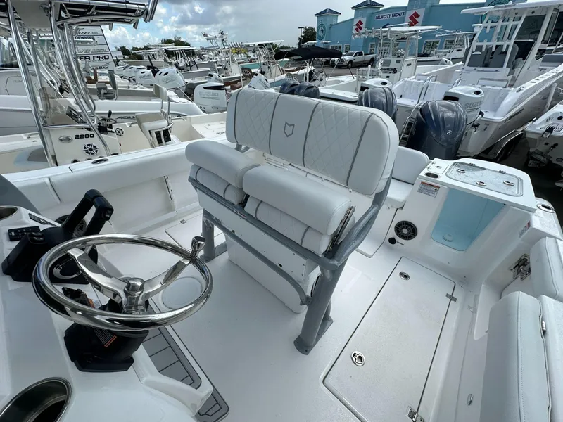 Slide: The Image of 2025 Sea Fox 268 Commander boat interior with steering wheel and seating. - 10