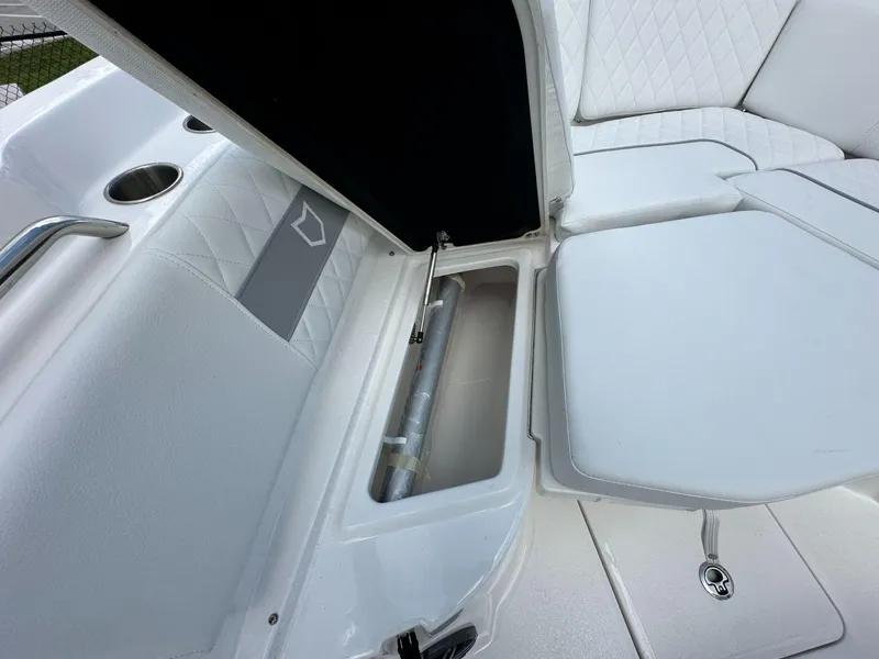 Slide: The Image of 2025 Sea Fox 268 Commander boat interior with storage compartment and cushioned seating. - 12