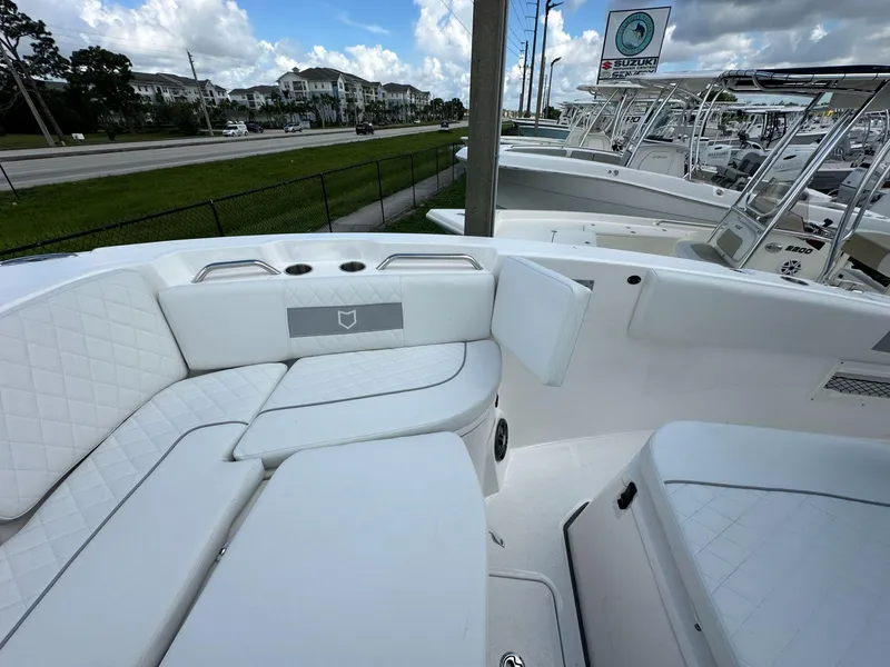 Slide: The Image of 2025 Sea Fox 268 Commander boat interior with white seating and modern design. - 14
