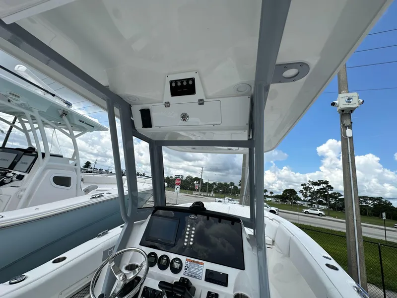 Slide: The Image of 2025 Sea Fox 268 Commander boat interior with steering wheel and dashboard controls. - 5