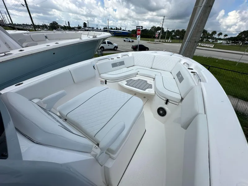 Slide: The Image of 2025 Sea Fox 268 Commander boat with spacious white seating area. - 6