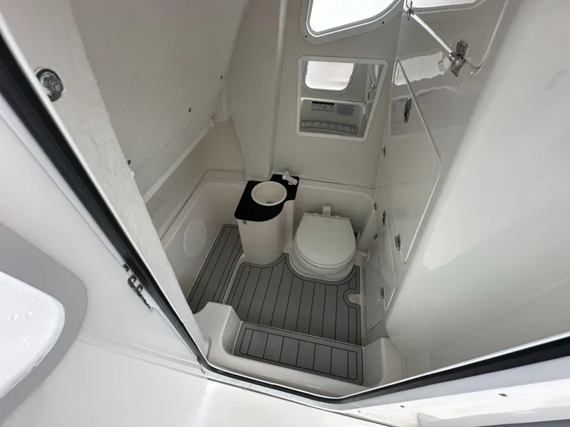 Slide: The Image of 2025 Sea Fox 268 Commander boat bathroom interior with toilet and sink. - 9