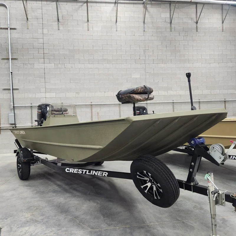 Slide: The Image of 2024 Crestliner 1860 Retriever SC boat on trailer in warehouse setting. - 10