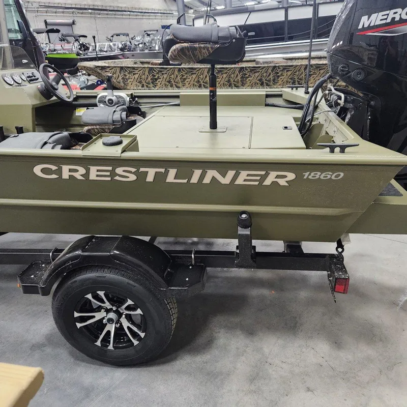 Slide: The Image of 2024 Crestliner 1860 Retriever SC boat on trailer in showroom. - 13