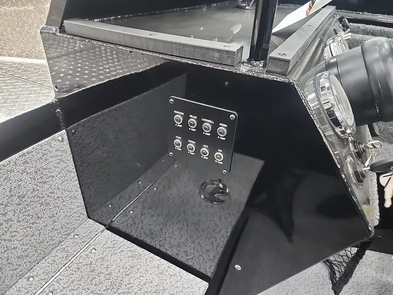 Slide: The Image of 2024 Crestliner 2050 Commander Elite dashboard with control panel and switches. - 15