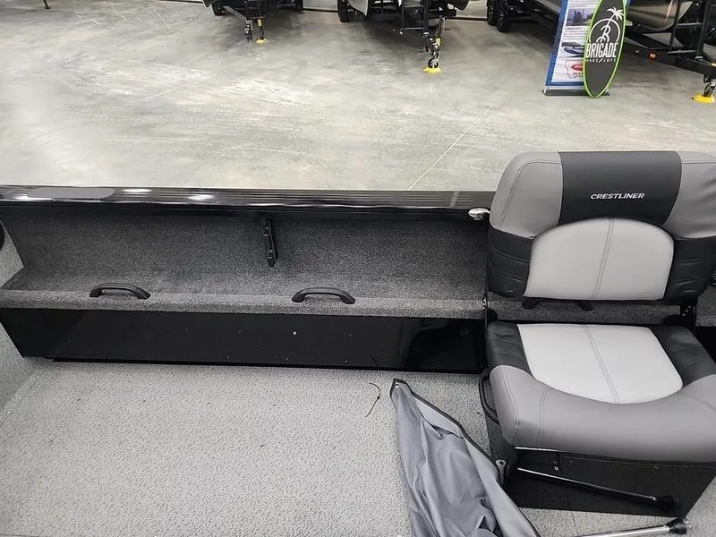 Slide: The Image of 2024 Crestliner 2050 Commander Elite interior with seating and storage. - 17