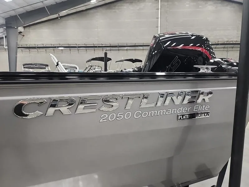 Slide: The Image of 2024 Crestliner 2050 Commander Elite boat in showroom, side view. - 18